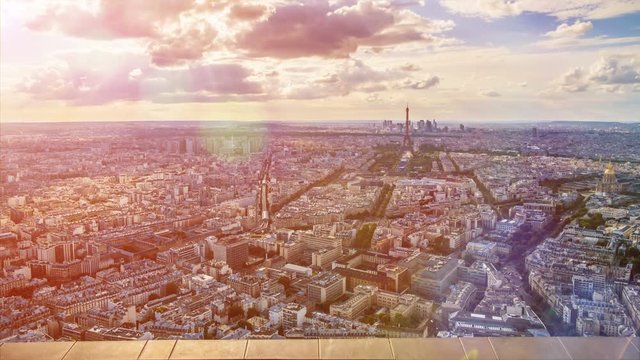 Colorful aerial Paris cityscape, active life in streets, cloudy sky, time-lapse