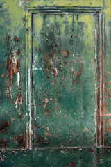 Textured wooden wall, vintage dark background with a green grain texture