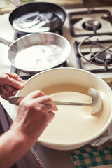 Grandmother making pancakes