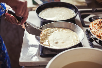 Grandmother making pancakes