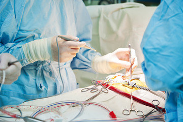 surgery operation. hands of surgeon with tool