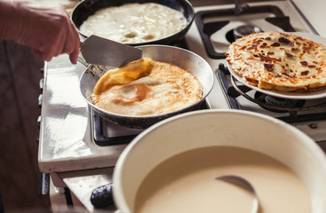 Grandmother making pancakes