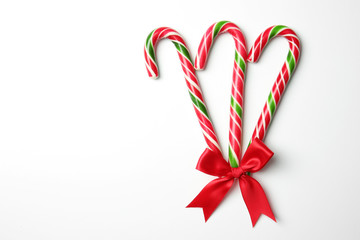 Christmas candy canes on white background