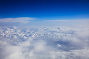 Blue sky and clouds - view from plane window