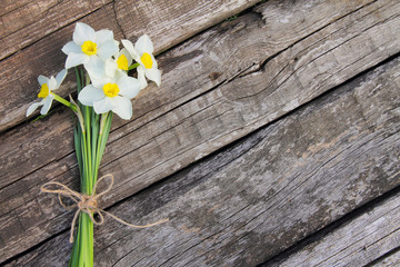 Bouquet of daffodils on a wooden background
