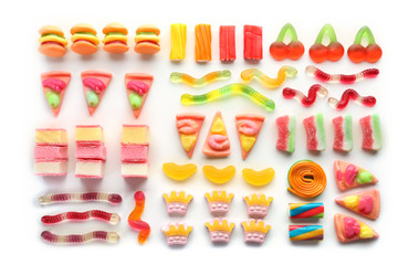Composition of colorful jelly candies on white background