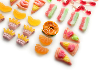 Composition of colorful jelly candies on white background