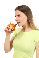 Beautiful woman drinking fresh juice on white background