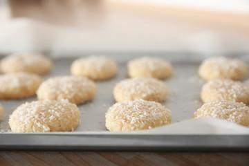 Baking tray with coconut cookies, closeup