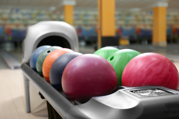 Naklejka na ściany i meble Colorful balls on rack in bowling club