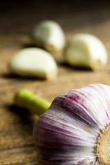 fresh violet garlic on the wooden table