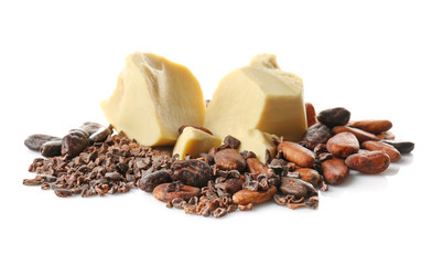 Pile of cocoa beans, butter and nibs on white background