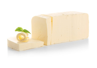 Cut piece of butter on white background