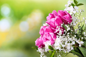 Beautiful bouquet of spring flowers on blurred background