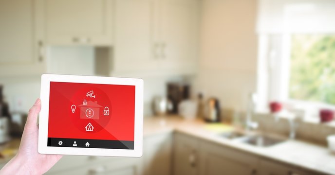Hand using smart home app in kitchen