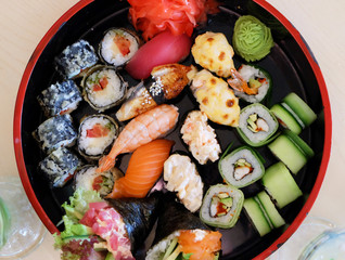 Japanese dishes: sushi, rolls, sashimi.