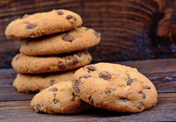 Chocolate chip cookies on wooden background