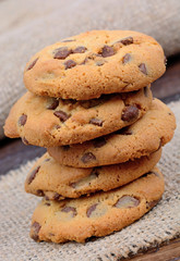 Stack of delicious cookies on table