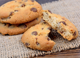 Pile of chocolate chip cookies on table