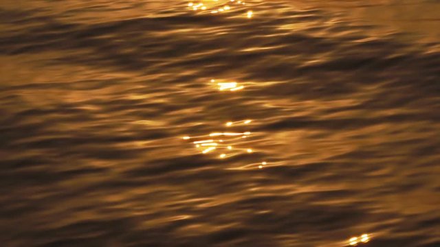 Sun glares reflected from surface river in the morning, Slow motion

