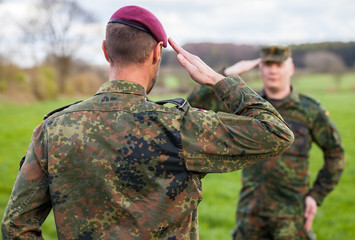 two german soldiers salute each other