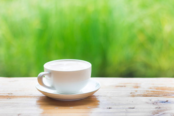 A cup of hot coffee is placed