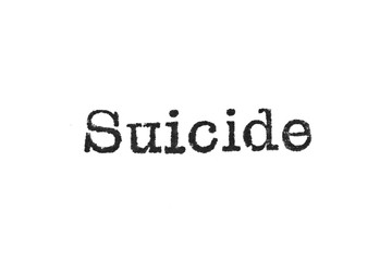 The word "Suicide" from a typewriter on a white background