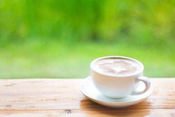 A cup of hot coffee is placed