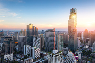 View of Bangkok modern office buildings, condominium in Bangkok city downtown with sunset sky...