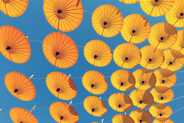 Fototapeta na wymiar Decoration by colorful umbrella with sky background.