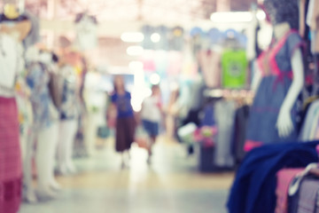 Blurred image of retail store in shopping mall for background.
