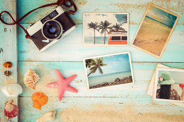 Top view composition - Summer photo album with starfish, shells, coral and items on wooden table. Concept of remembrance and nostalgia in summer tourism, travel and vacation. vintage color tone.