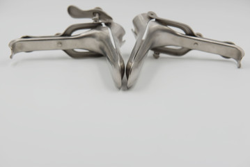 speculum on white background. Medical concept .