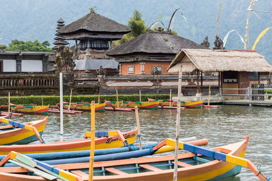 Colorful wooden fishing boats on the balinese temble background. Tropical magic island Bali, Indonesia.