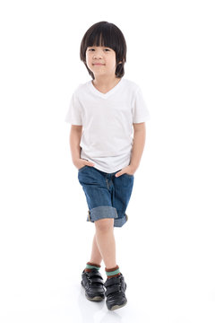 child  in white t-shirt and jeans standing on white background