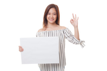 Young Asian woman show OK with white blank sign.