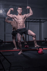 Fototapeta na wymiar bodybuilder posing, arms outstretched