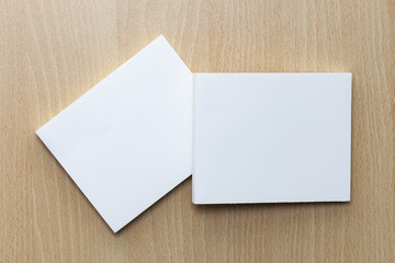 Blank white business cards on wooden background for branding identity and designers
