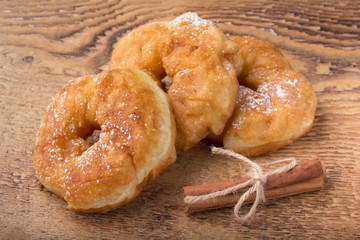 sugary donut on a wooden background