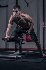 Fototapeta na wymiar bodybuilding, flat bench, Kettle Bell exercise
