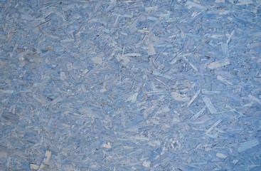 Soft pastel blue particle board compressed sawdust corkboard background