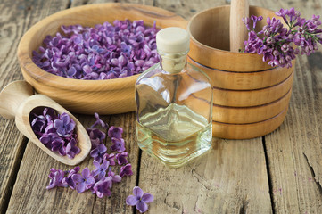 Fototapeta na wymiar Massage and spa products with lilac flowers