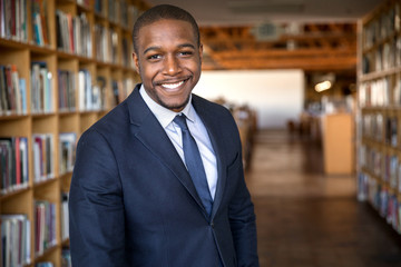Stylish african american professor education administrator business executive type standing in hall