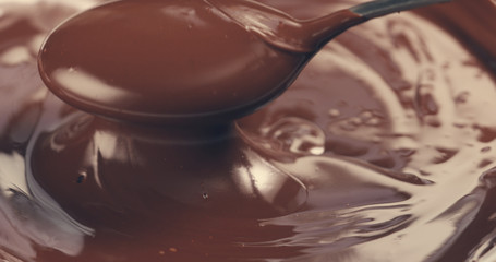 premium dark melted chocolate mix with spoon toned, 4k photo