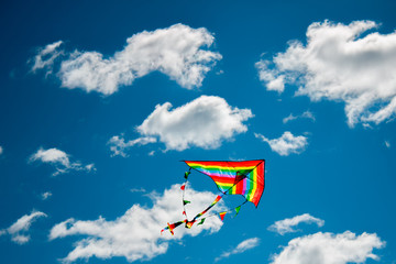 Kite flying against the background of clouds
