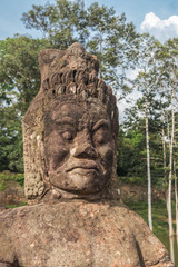 Detail of Asura Guardian head in the bridge on the South Gate of Angkor Thom. Siem Reap, Cambodia