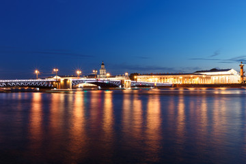 Fototapeta na wymiar Palace bridge in Saint Petersburg, Russia at night. Illumination and lights, dark blue sky