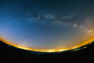 Astro Landscape with the Milky Way as seen from the Luitpold Tower in the Palatinate Forest in Germany.
