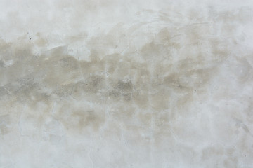 The old Soviet white wall of concrete in the whitewashed