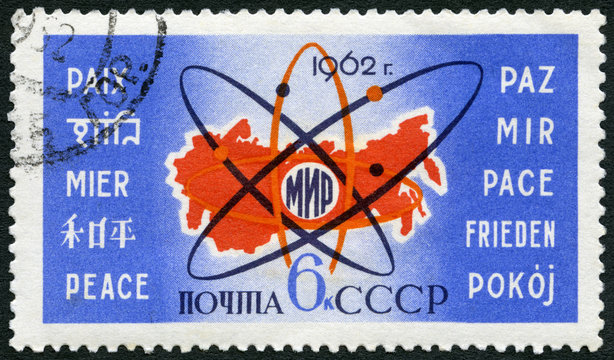 USSR- 1962: shows Map of USSR, atom symbol and Peace in 10 languages, use of atomic energy for peace